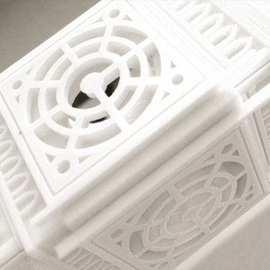 Close-up of a white decorative object with intricate patterns