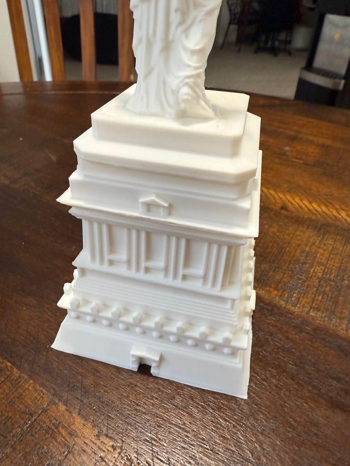 Close-up view of the pedestal base on the 3D printed Statue of Liberty model, highlighting column and brick textures.