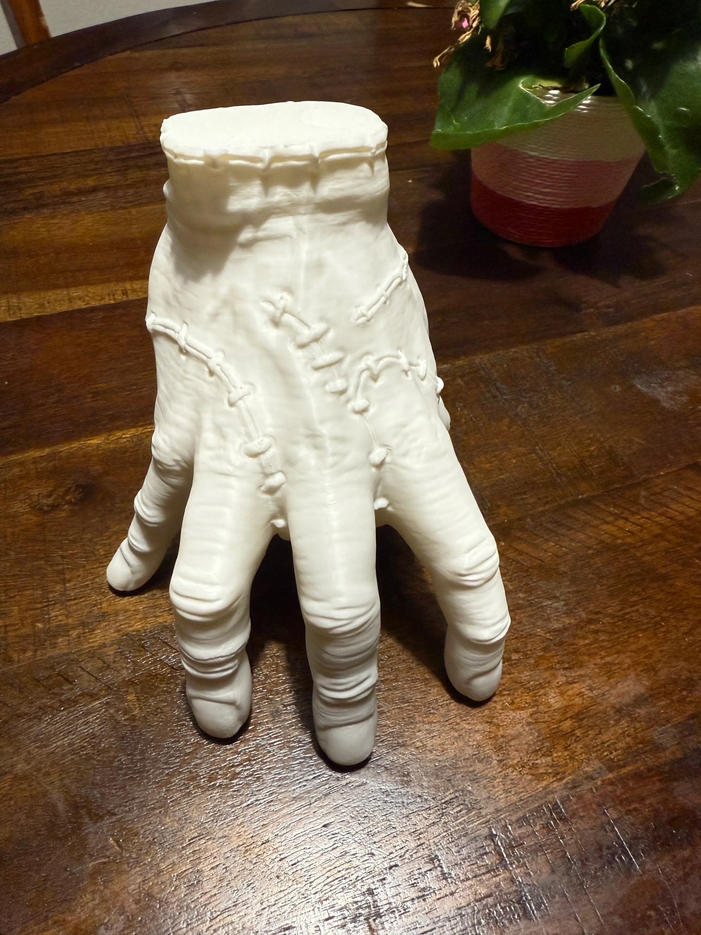 Life-size Addams Family Thing hand cosplay replica, front angle 3D print in PETG with stitched scar design