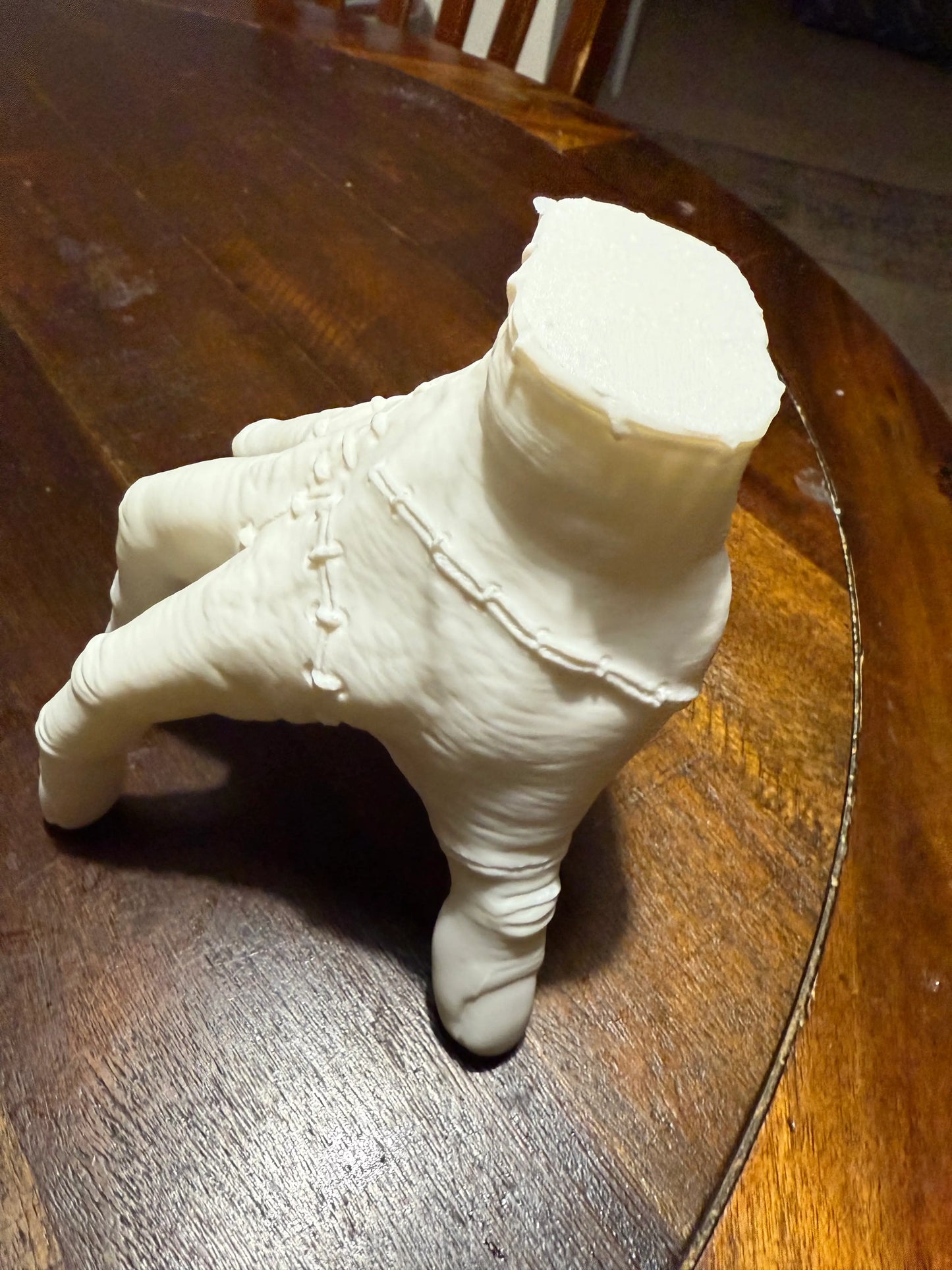 Addams Family Thing cosplay hand model 3D printed in PETG, angled side view showing realistic texture and cut wrist